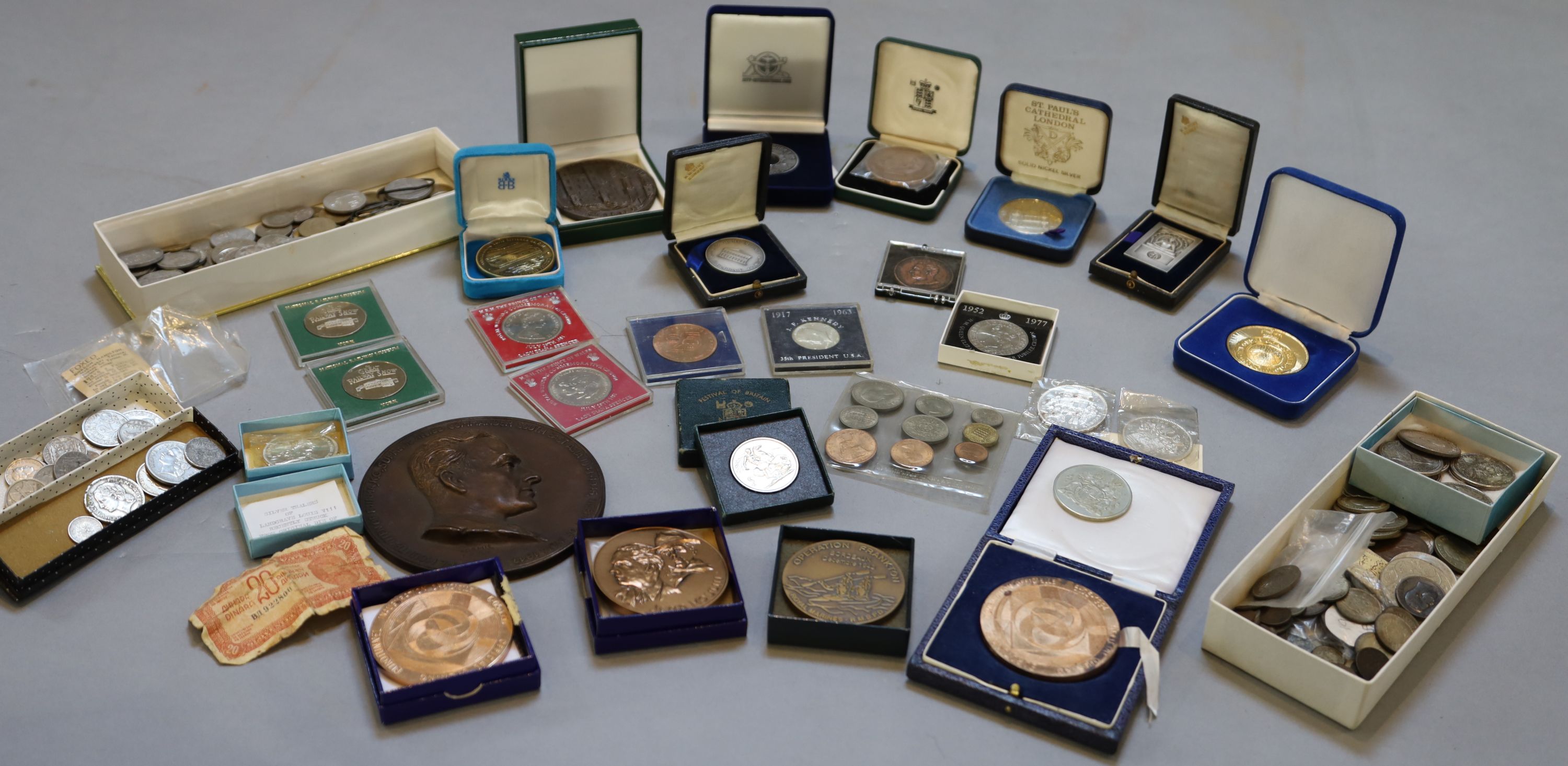 A collection of assorted coins and medallions